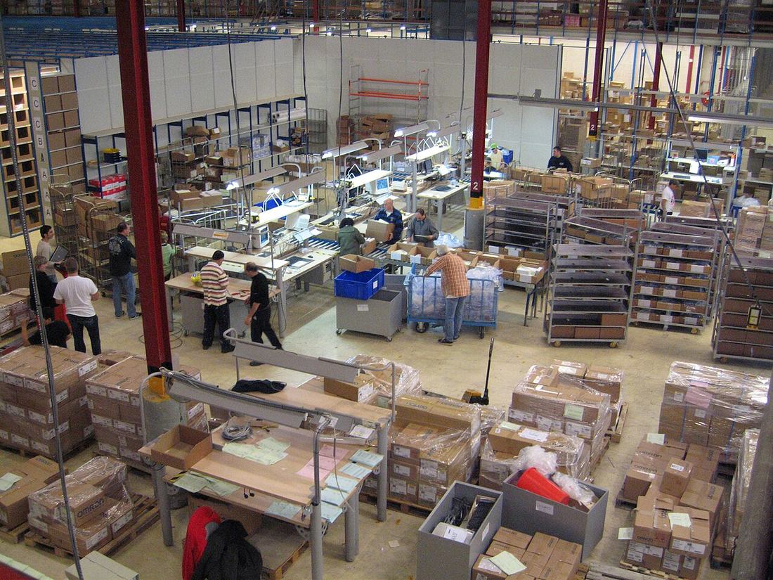 how to pack orders for meesho shipping - workers packing parcels at warehouse dispatch stations 2026